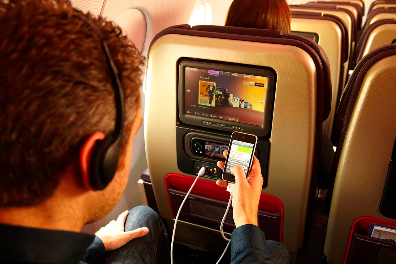 A passenger using the in-flight UI
